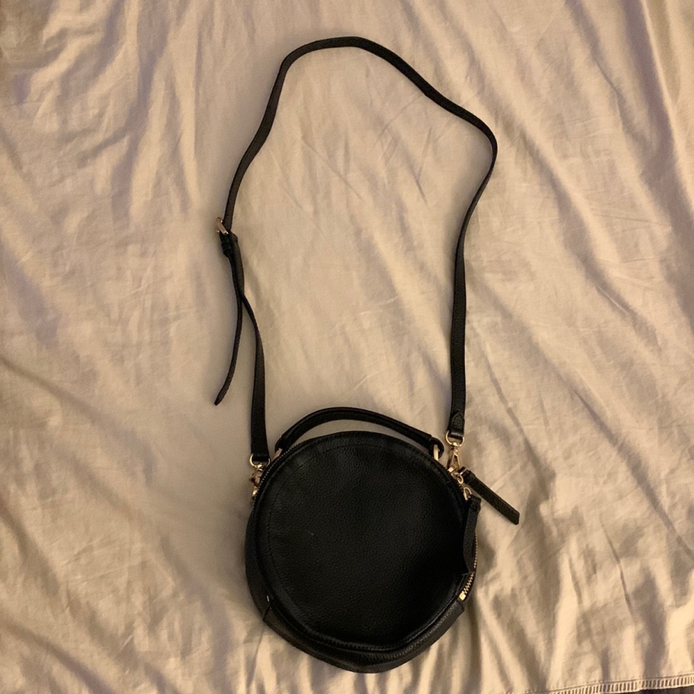 Circle crossbody black purse.